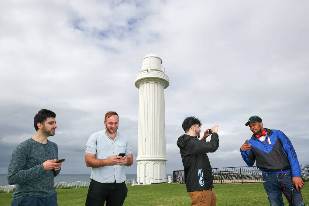 Egames: Tournament organiser Sean Thorpe (2nd from left) with professional gamers Ramin Delshad, Jonathon Reyes and Tyrell Coleman check out Flagstaff Hill, Wollongong before competing in Shellharbour this weekend. Picture: Adam McLean.
