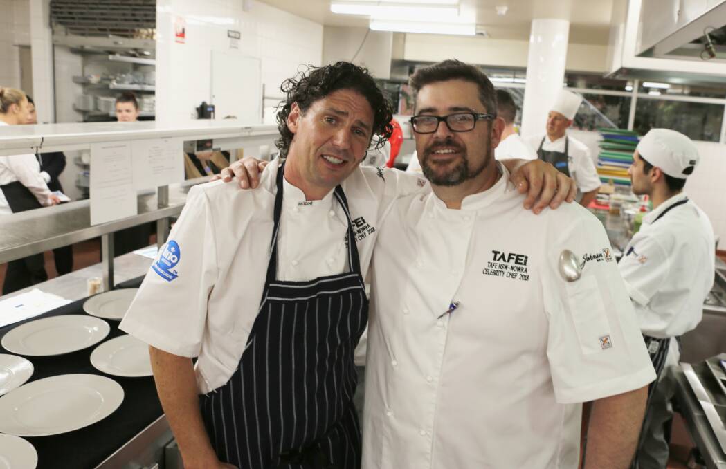 Dining with the kitchen stars: Colin Fasnidge and Luke De Ville in the kitchen at the 16th annual TAFE Celebrity Chef Degustation Dinner in Bomaderry. Picture: Greg Ellis.
