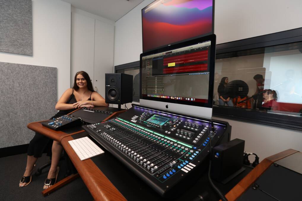 Singing chef: Cinnamon McGregor, 20, inside the new state-of-the-art sound recording studio at Southern Youth and Family Services' new community facility at Warilla. Picture: Robert Peet.