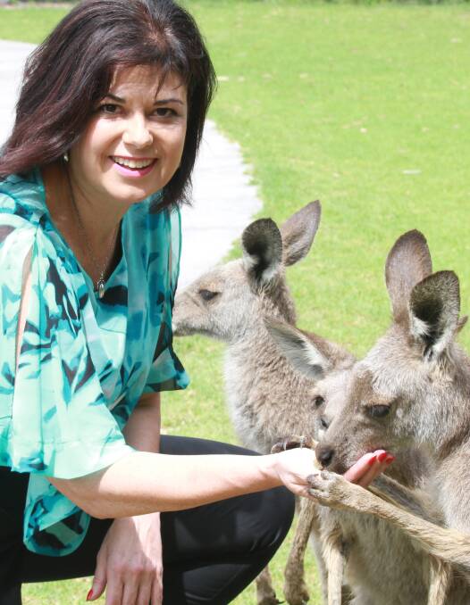 Making friends: Nieves Murray mixing with some famous Aussies at Symbio Wildlife Park. Picture: Greg Ellis.
