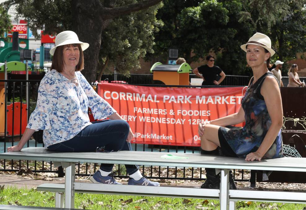 They're back: Claire Roberts and Kerrie Humphrey, of HiViz Events, prepare for next Wednesday's markets at Corrimal Memorial Park. Picture: Robert Peet.
