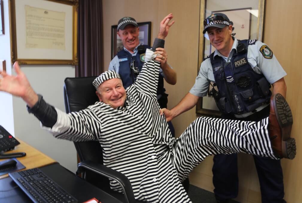 Doing time for kids: Wollongong Lord Mayor Gordon Bradbery is arrested in his office by senior constables Darren Palk and Paul Marriott. Picture: Greg Ellis
