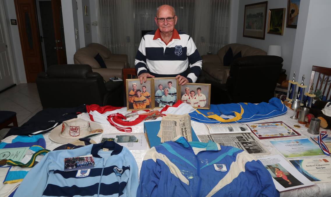 Bruce Jones with a life of memorabilia including progress photos of Shane Lee, Heath Muller and Anthony McQuire who he coached at the Illawarra, NSW and Australian academies. Pic: Greg Ellis.

