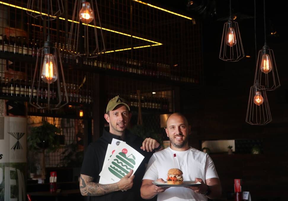 Positions vacant: Robert Gorgievski and Allen Markovski at Grill'd Wollongong which like many other eateries is having trouble finding staff. Picture: Sylvia Liber.