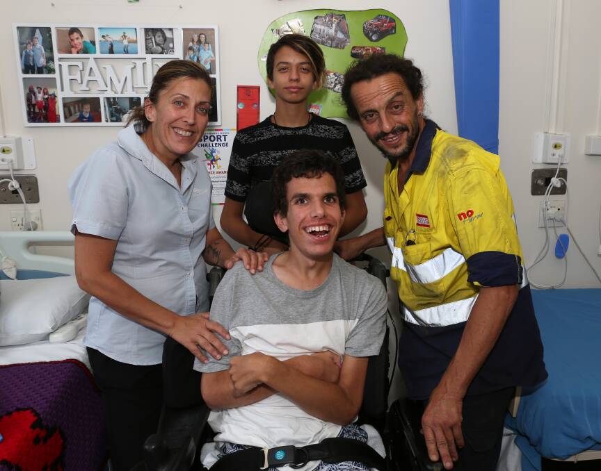 Family love: Brigitte, Marley and Cipriano Vieira-Torrecilla with Brandon Vieira-Torrecilla at Port Kembla Hospital. Picture: Greg Ellis.


