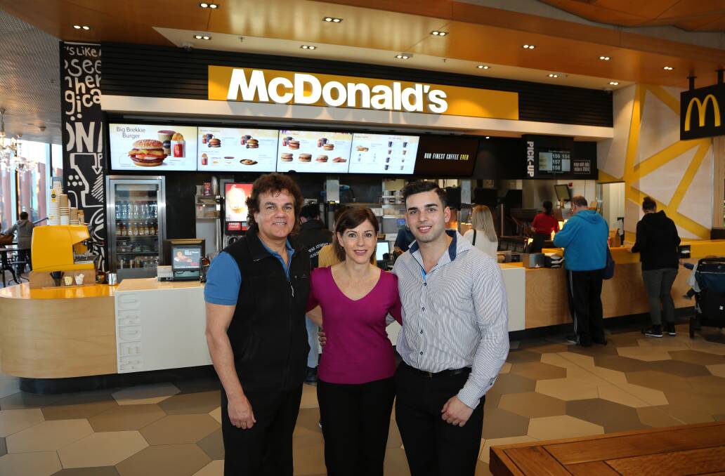 Reward for exemplary service: Glenn, Katia and James Dwarte at the family's fourth McDonald's store in the Illawarra. Picture: Greg Ellis.
