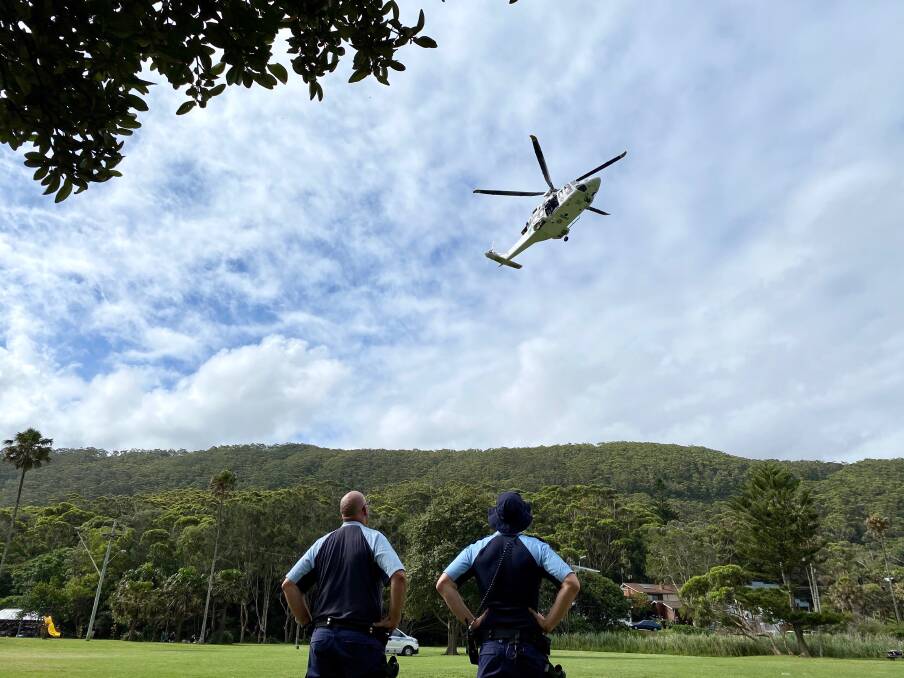 Rescue helicopter hovers over bushwalking tack near Stanwell Park. Picture: Angela Thompson.