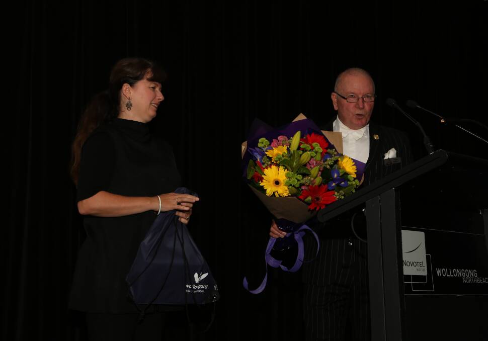 Thank you: Wollongong Lord Mayor Gordon Bradbery acknowledges Tanya Phillips and presents her with flowers to thank her for her tireless work. Picture: Greg Ellis.
