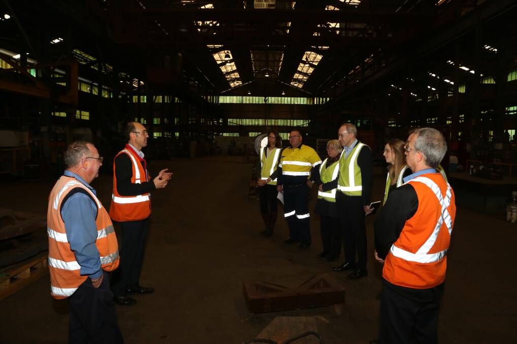 Industry interest: Klondu Group general manager Robert Donsante (second left) conducting a tour of one of the workshops at Steelhaven. Pictures: Greg Ellis.

