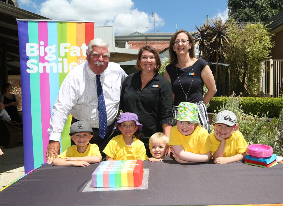 Big fat celebation: Chair David Campbell, centre director Jane Morgan and CEO Jenni Hutchins ready to cut the 40th birthday cake at Big Fat Smile's Helensburgh Community Preschool. Picture: Greg Ellis.



