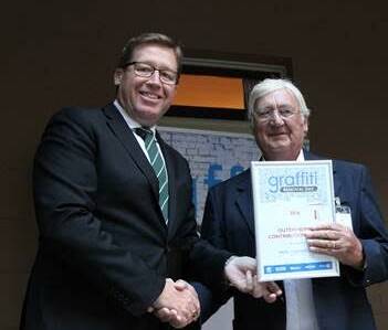 Recognition: NSW Police minister Tony Grant with Mick Chamberlain.






