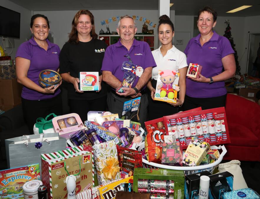 Season of giving: Erin Davey, Mandy Booker, Dale Cairney, Monique Bussoletti and Mellisa Walters at Wollongong Homeless Hub. Picture: Greg Ellis 
