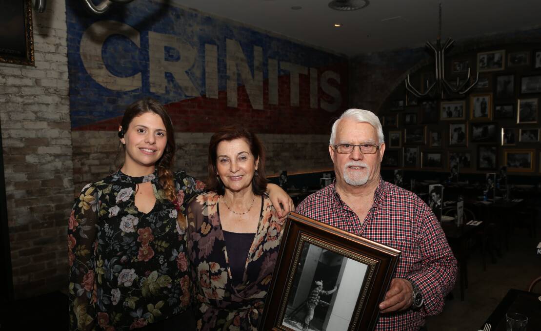 Listening and improving: Restaurant manager Sarah Giusti with Rosa Criniti and Cosimo Criniti with a picture of him working in Wollongong in the 1960's. The building in the black and white photo is now part of the University of Wollongong campus. Picture: Greg Ellis.
