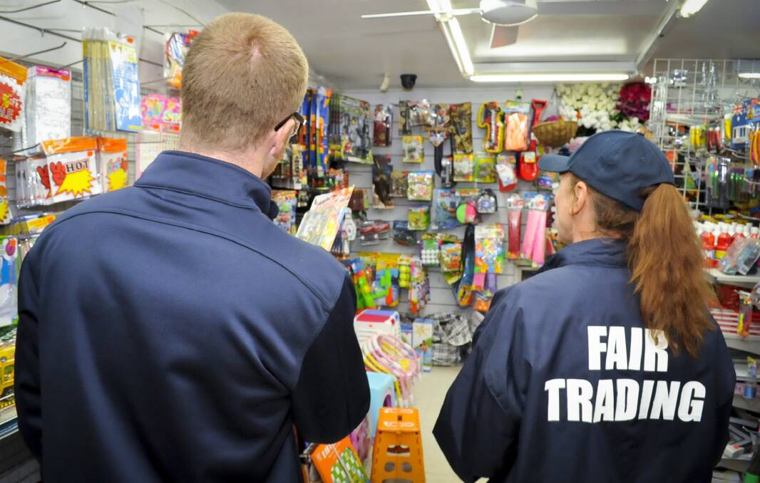 Removing danger: NSW Fair Trading inspectors during a pre-Christmas dangerous toys blitz in the Illawarra. 
