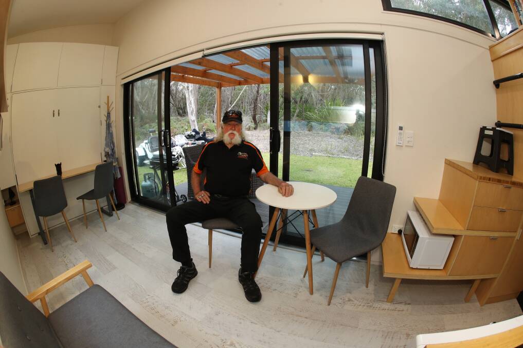Steve Melchior inside his Top Stay Accommodation Airbnb tiny home at Stanwell Tops. Picture: Robert Peet.
