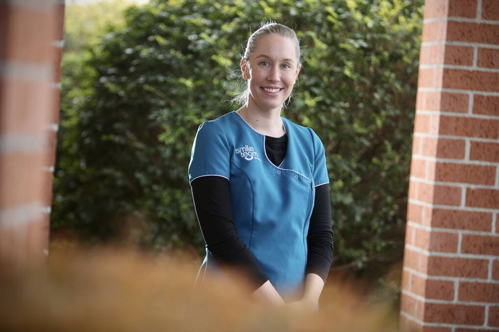 Vaccine incentive: Smile Team Orthodontics Shellharbour centre manager Amy Gilbert had her second COVID vaccination on Monday. Picture: Adam Mclean.