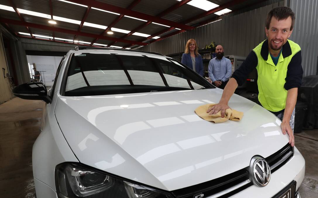 Opportunity: Flagstaff's Belinda Franklin, Bears Auto Group general manager Steve Lozenkovski and Troy Fitzsimmons who has been learning new skills as a detailer. Picture: Robert Peet.