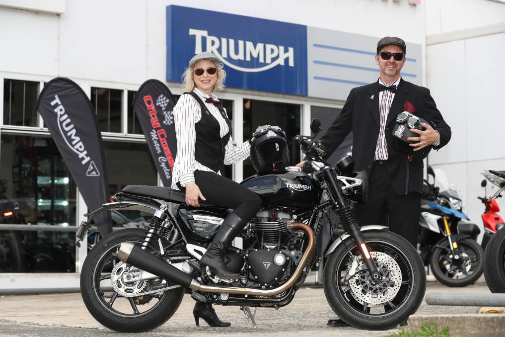 Working together by going solo: Jane and Tim Sim at City Coast Motorcycles dress up to reveal news plans for Wollongong's Distinguished Gentleman's Ride for Men's Health during COVID-19. Picture: Robert Peet. 