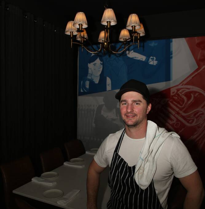 Debutant debut: Daniel Sherley prepares for the first customers at his new Debutant eatery on the site of the former Cheeky Fig restaurant in Keira Street, Wollongong.
