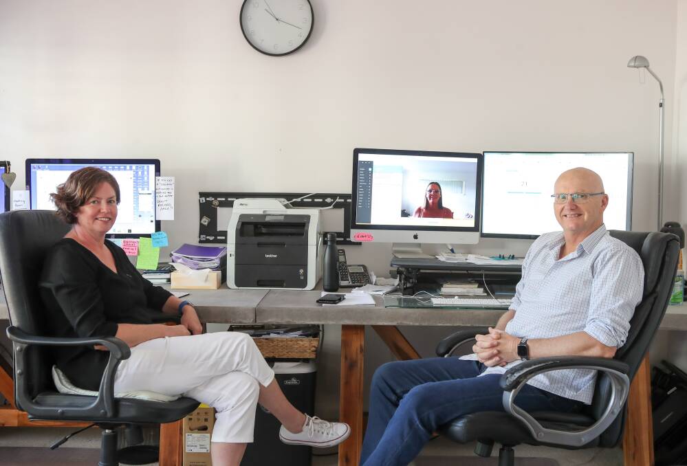 Growing business: Wendy and Andrew Williams at home office in Woonona with Kylie Gilroy online in Mackay. Picture: Adam McLean. 