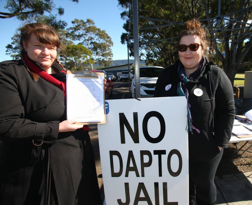 Helping out: Natasha Gore and Hayley Hodgson collected signatures for a petition and told people about a march next Sunday. Picture: Goergia Matts.

