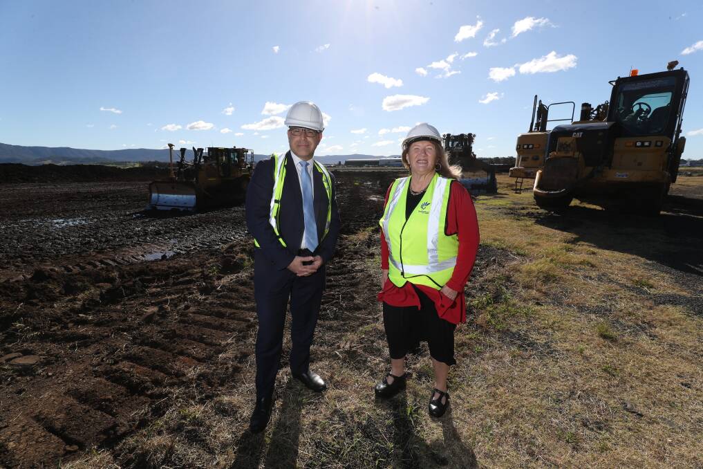 Work begins: Peter Poulos MLC and Shellharbour mayor Marianne Saliba at the construction site for the new Shellharbour Aviation Business Park. Picture: Robert Peet.