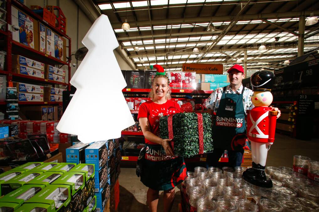 Festive decorations: In the home co-ordinator Kate Moore and complex manager Aaron Mott with some of the Christmas light range in stock at Bunnings Wollongong. Picture: Anna Warr