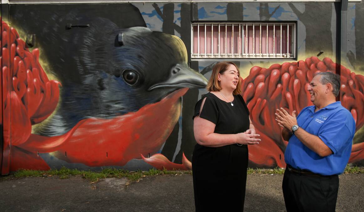 Art attack: Cr Jenelle Rimmer and Paul Boultwood at a new mural commissioned by Corrimal Region Action Group, Corrimal Chamber of Commerce and Wollongong City Council to cover up graffiti in Woonona. Pic: Adam McLean. 