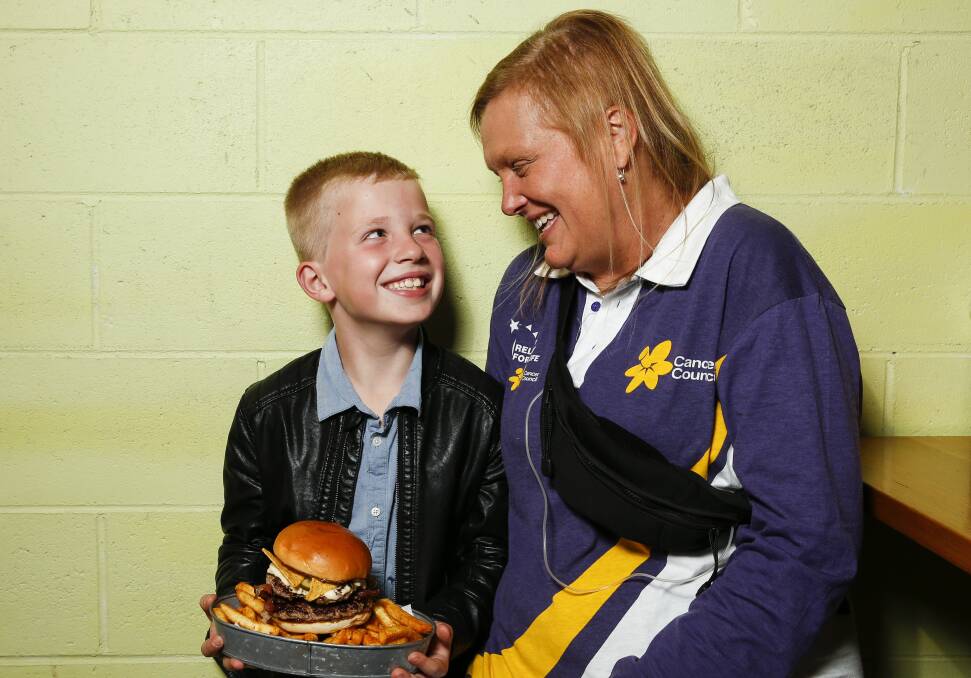 Loving son: Angie Howes with her son Oscar, 7, who has made a special burger for his mum to help raise funds for the Cancer Council's 2020 Wollongong Relay for Life. Picture: Anna Warr.