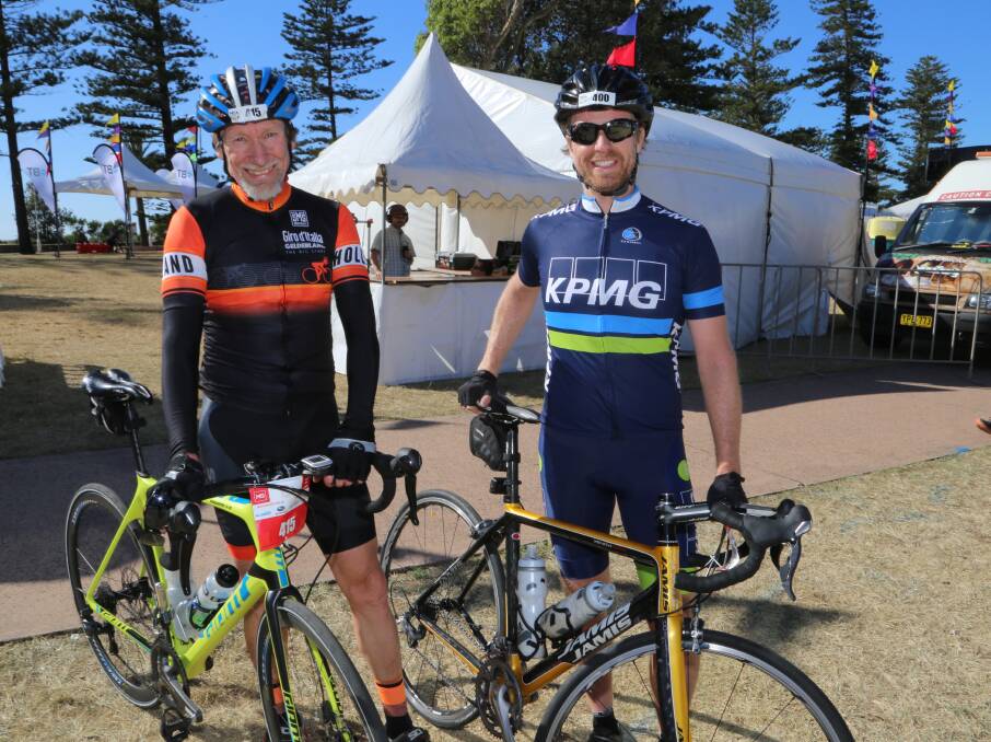First home: Craig Morris and James Walker have met on the road during the MS Sydney to Gong bike ride each of the last two years and crossed the line together both times. Picture: Greg Ellis.

