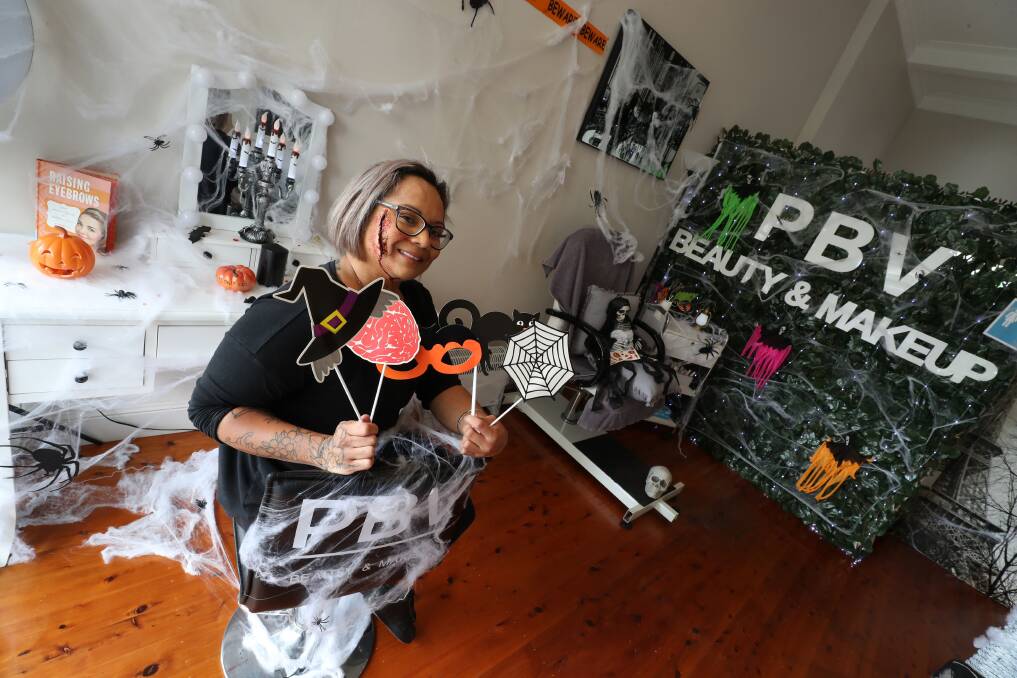 Beautician with mas-scare-a: Port Kembla beauty therapist Jael Aviles spent the weekend decorating her salon for this Saturday's Halloween Festival in Wentworth Street. Picture: Robert Peet.