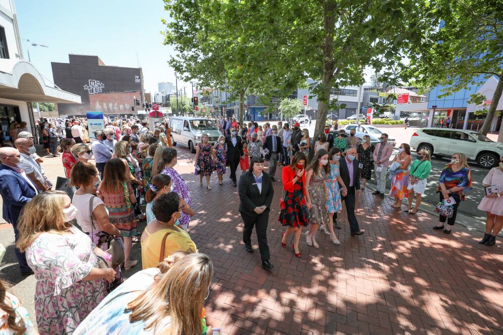 Farewell: 400 invited guests formed a guard of honour for Chloe Saxby outside Wollongong Town Hall after a funeral service where everyone was invited to dress in colour to celebrate her life. Picture: Adam McLean.