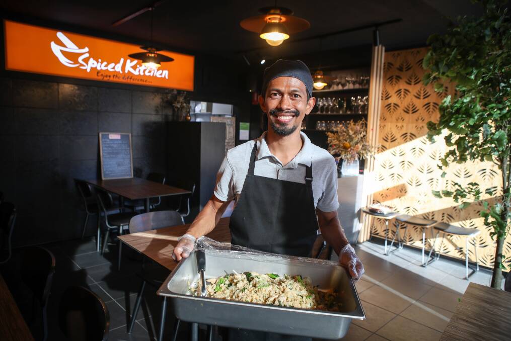 Helping hand: Spiced Kitchen's Paul Rongyen with some of the free food he prepared for the unemployed and those doing it tough-19 during the COVID-19 pandemic.Picture: Adam McLean. 
