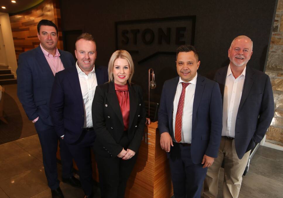 Gong boom: Paul Piacentin, Jeremy Hodder, Sarah Ward, David Scioscia and Michael Schlegel are part of the expanding team at Stone Real Estate Wollongong. Picture: Sylvia Liber.