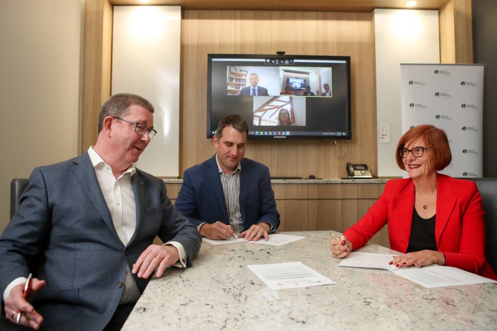 NextGen planning: Graham Lancaster, Daniel Rowan and Debra Murphy sign an MOU to extend the Illawarra Leadership Program three years. Picture: Adam McLean. 