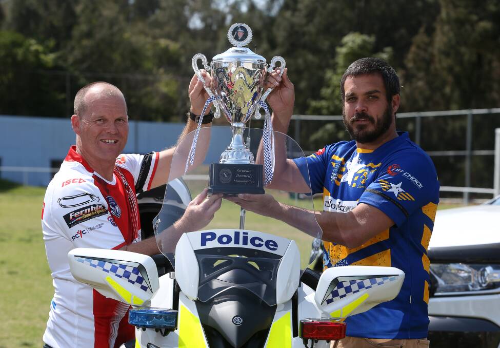 Police Legacy: Jeremy Barnett from the Wollongong Falcons and Jye Sommers from the Lake Illawarra Lions at the launch of the Graeme Donnelly Cup for Police Legacy. Picture: Robert Peet
