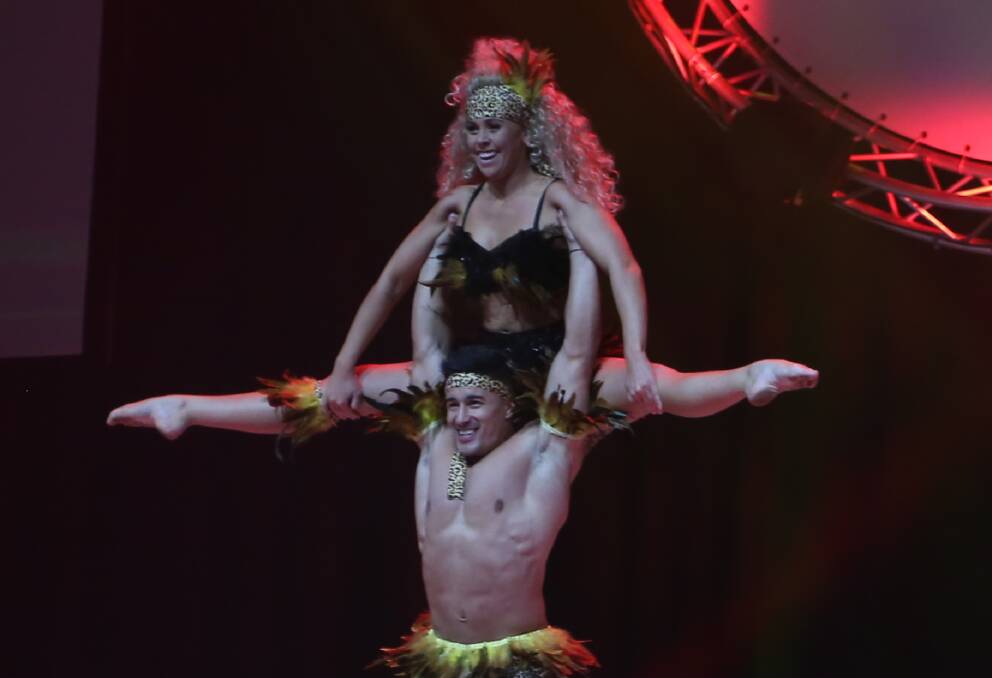 Power and the passion: Daniel lifts Maddison during their energetic routine. Picture: Greg Ellis.



