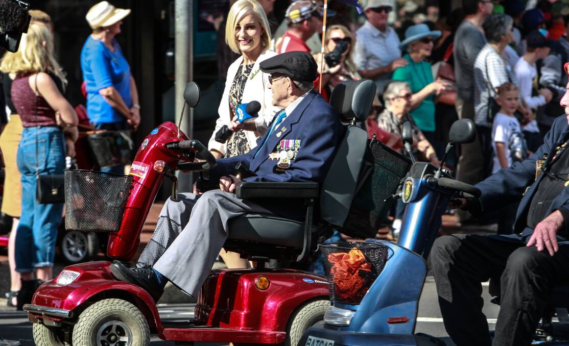 Thousands turn out: Many people of all ages lined the streets for the Wollongong Anzac Day march on Monday morning. Picture: Georgia Matts.
