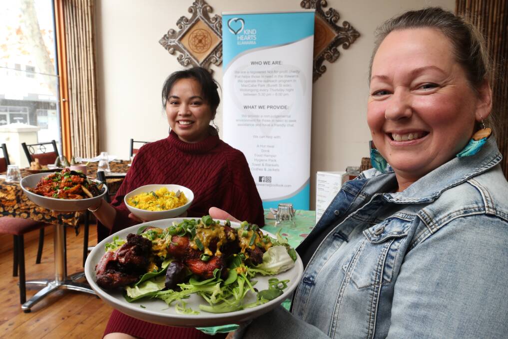 Balinese generosity: Jules Mitry, of Balinese Spice Magic, with Stephanie MacLeod, of Kind Hearts Illawarra, with some of the food the Keira Street eatery is famous for. Picture: Robert Peet.