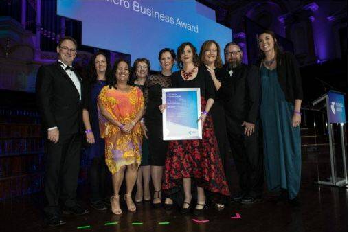 Big win: Wollongong's Natalie Chapman and her team accepting the micro-business award win at the NSW final of the Telstra Business Awards.

