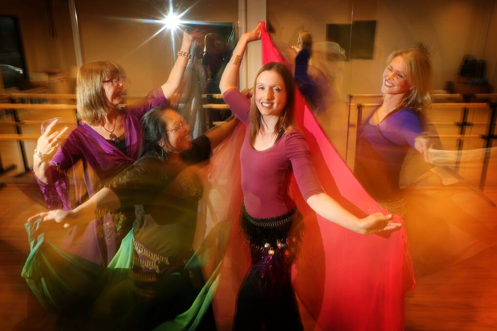 Belly dancing flash mob: Ellie Taylor (centre) with Margot Benoit, Belinda Cheng and Kylie Morrison rehearsing for Saturday's performance. Picture: Sylvia Liber. 