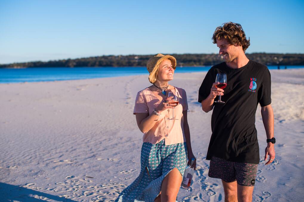 Rosé and calamari capital of Australia: Jervis Bay residents Emma Cox, 25, and Sam Duffy, 24, are among the locals who enjoy rosé.



