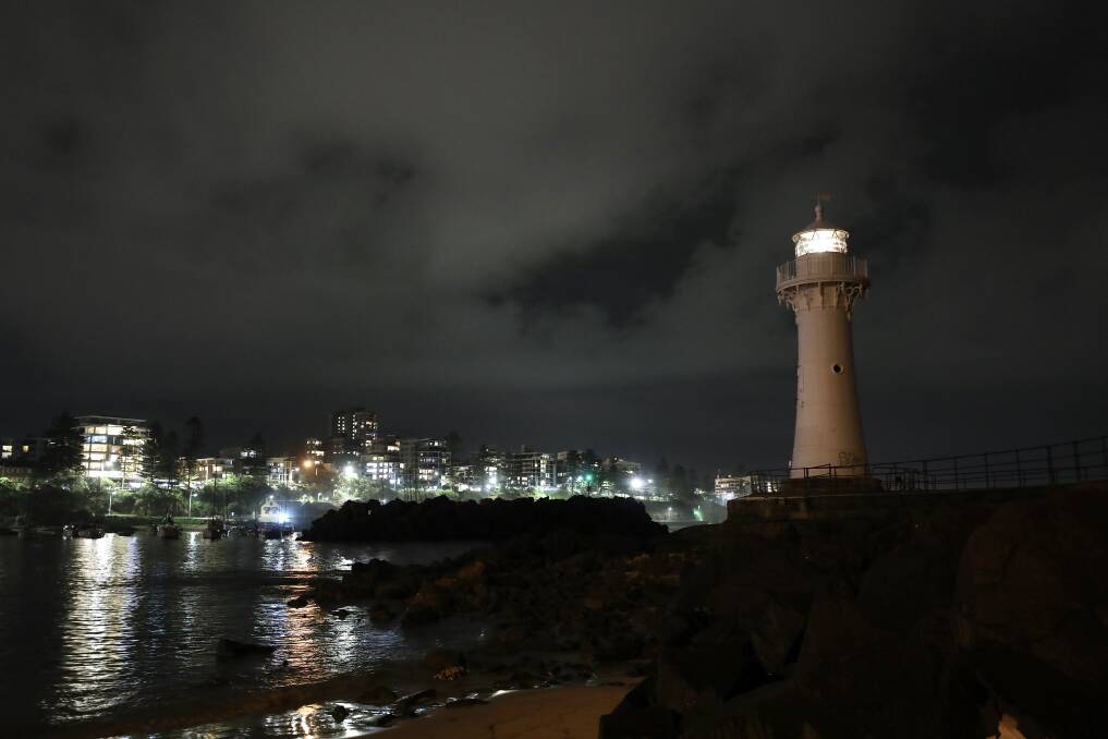Wollongong's Breakwater Lighthouse shining its light on Friday night. Picture: Adam McLean 