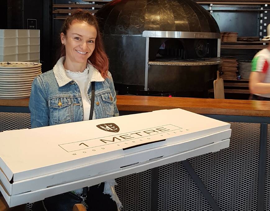 Pizza for a Purpose: Kathy Criniti with some of the 1 Metre Pizza's that helped the new Italian Restaurant in Wollongong raise $5000 for the Wollongong Children's Ward. 

