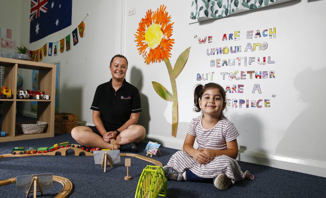 Support welcome: Wollongong Cottage Kindergarten director Paige Withnall with Melek Yasar, 3, after the Federal Government announces a new free child care plan. Picture: Anna Warr