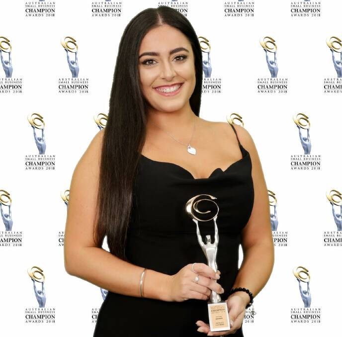 Shellharbour small business winner: Nicola Xanthopoulos, 23, of Nicola's Tutoring, with her national Sole Trader Champion Award at the Australian Small Business Champion Awards.


