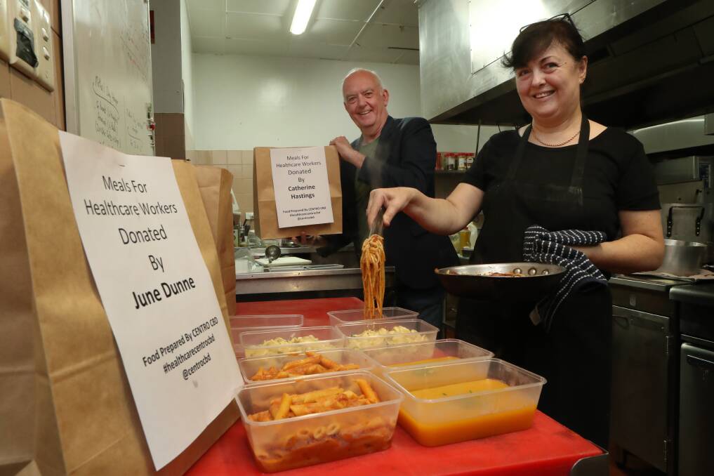Adopt a health worker: Robert Specogna and Mira Manojlovic prepare meals for Wollongong and Shellharbour hospital staff. Pic: Robert Peet. 