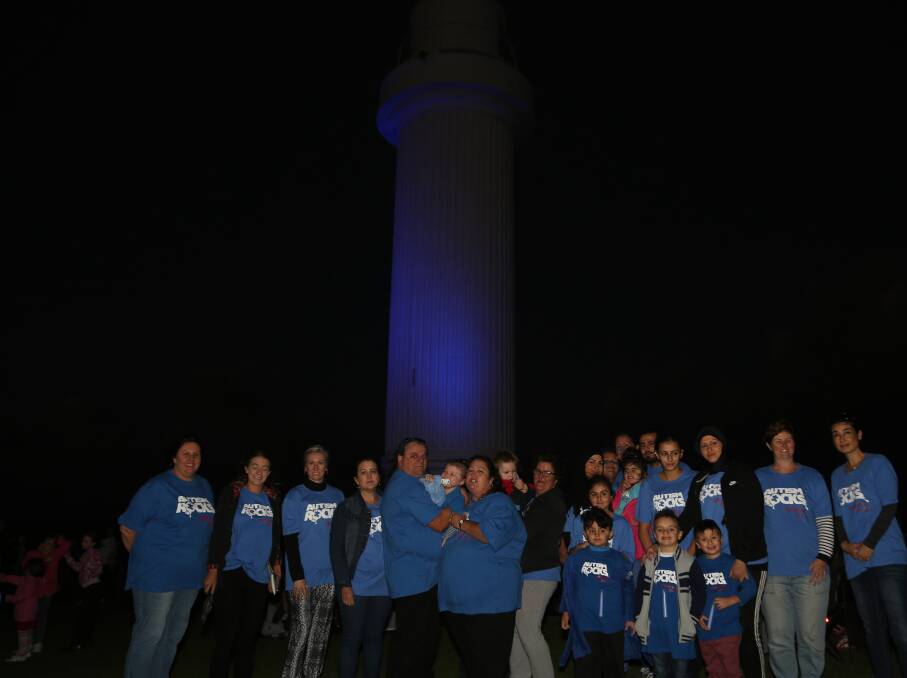 Raising awareness: Kylie O’Neill and her daughter Grace in front of the Flagstaff Hill Lighthouse in 2017 with many others who attended the free Glow Blue For Austism 
community event. Picture: Greg Ellis.