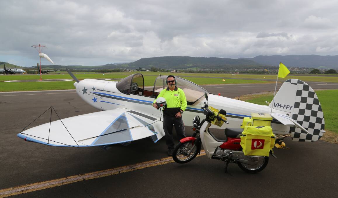 Runway success for postie: Karl Fort with his two favourite machines. He delivers mail by bike during the week and hits the sky doing aerobatics on the weekend. 
