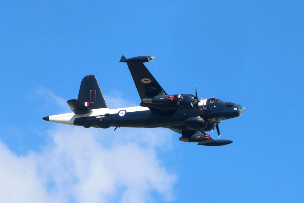Historic aircraft: HARS Aviation Museum does a fly over with its Lockheed Neptune at the official launch of Wings Over Illawarra. Picture: Sylvia Liber.
